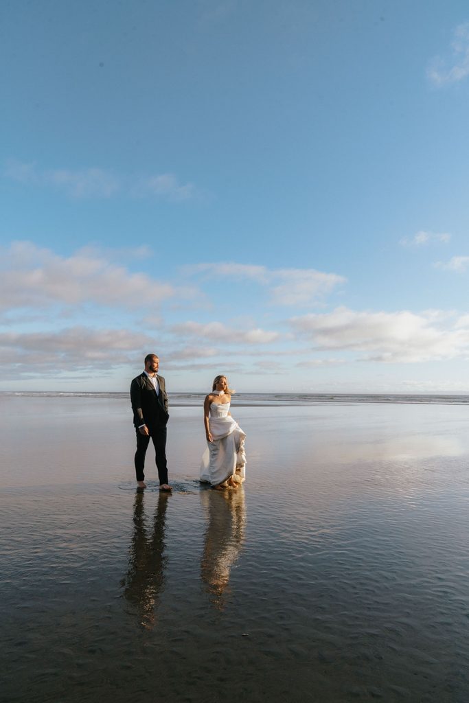 on the oregon coast at agate beach during sunset a wedding couple