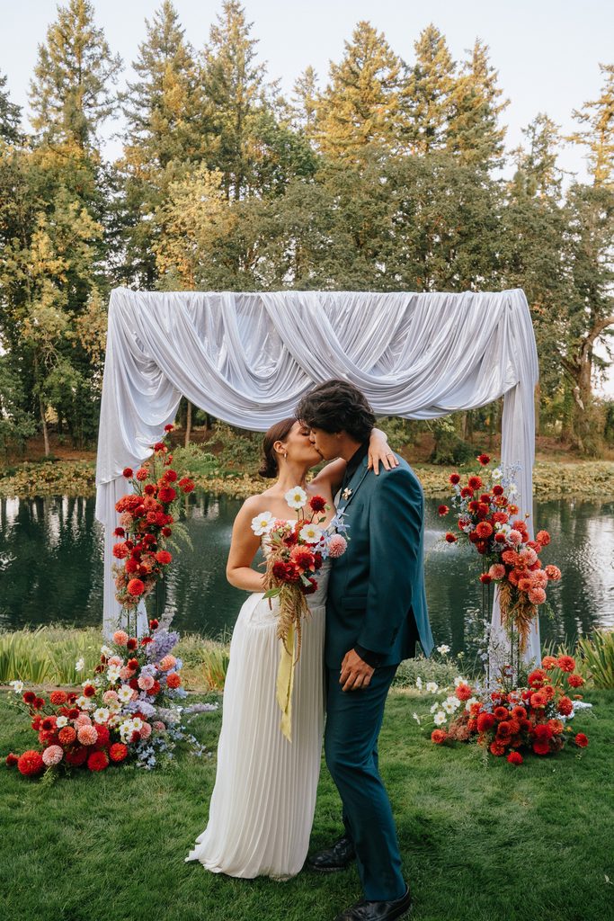 wedding couple kissing at alter near portland oregon