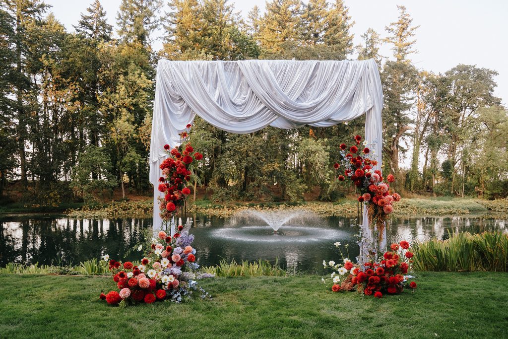 ceremony decor with whimsical florals at gardens at riverside wedding venue in oregon