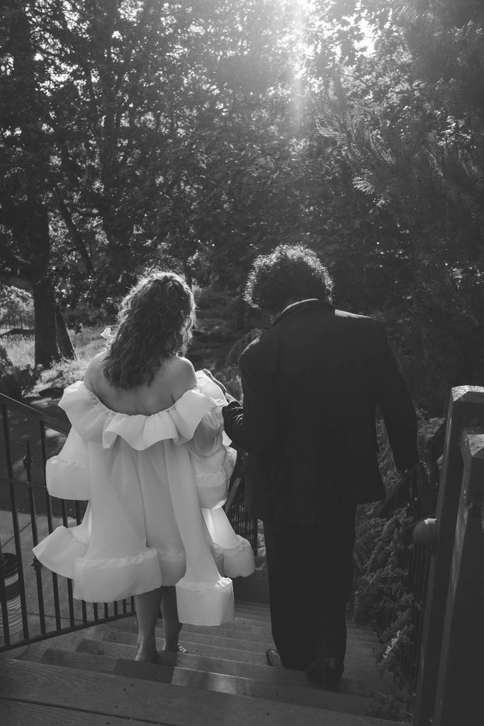 couple going down mount tom house staircase